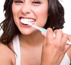 Woman brushing her teeth