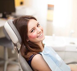 Smiling woman in dental chair