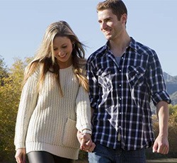 Smiling couple holding hands