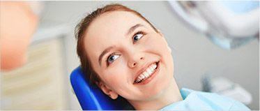 Smiling woman in dental chair