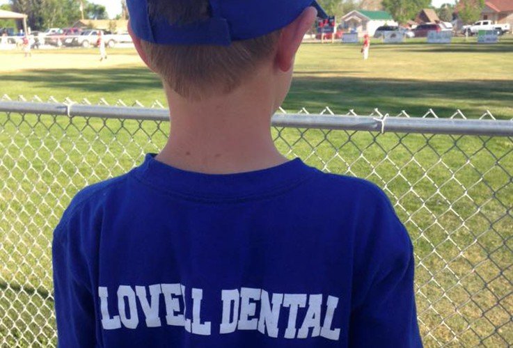 Boy with Lovell Dental baseball shirt on