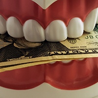 Stack of money placed in dentures in Lovell, WY