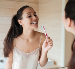 Woman brushing her teeth