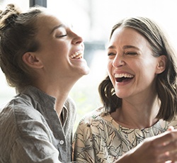 Two women laughing together