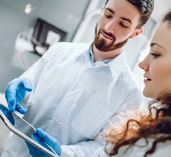 Dentist and patient discussing candidacy for dental implants