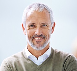 An older man smiling