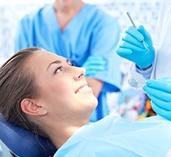 Woman receiving oral cancer screening