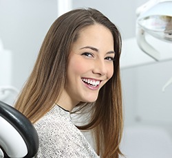 Woman smiling in the dental chair