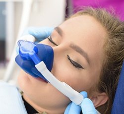 Woman with nitrous oxide nose mask