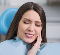 Woman holding jaw