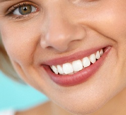 closeup of woman smiling after getting veneers in Lovell