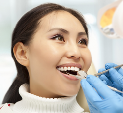 Woman receiving dental exam