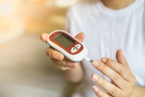 a person taking their blood sugar levels