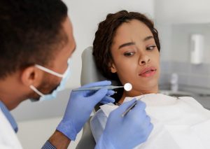 man looking scared in dental chair 