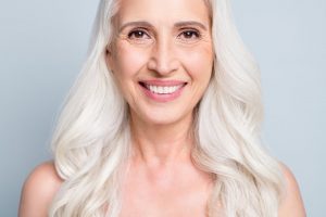 mature woman smiling with veneers